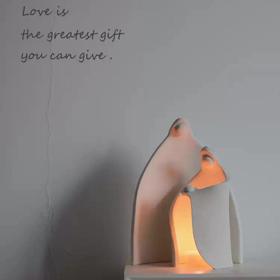 Minimalist ceramic family sculpture candle holder symbolizing love and shelter